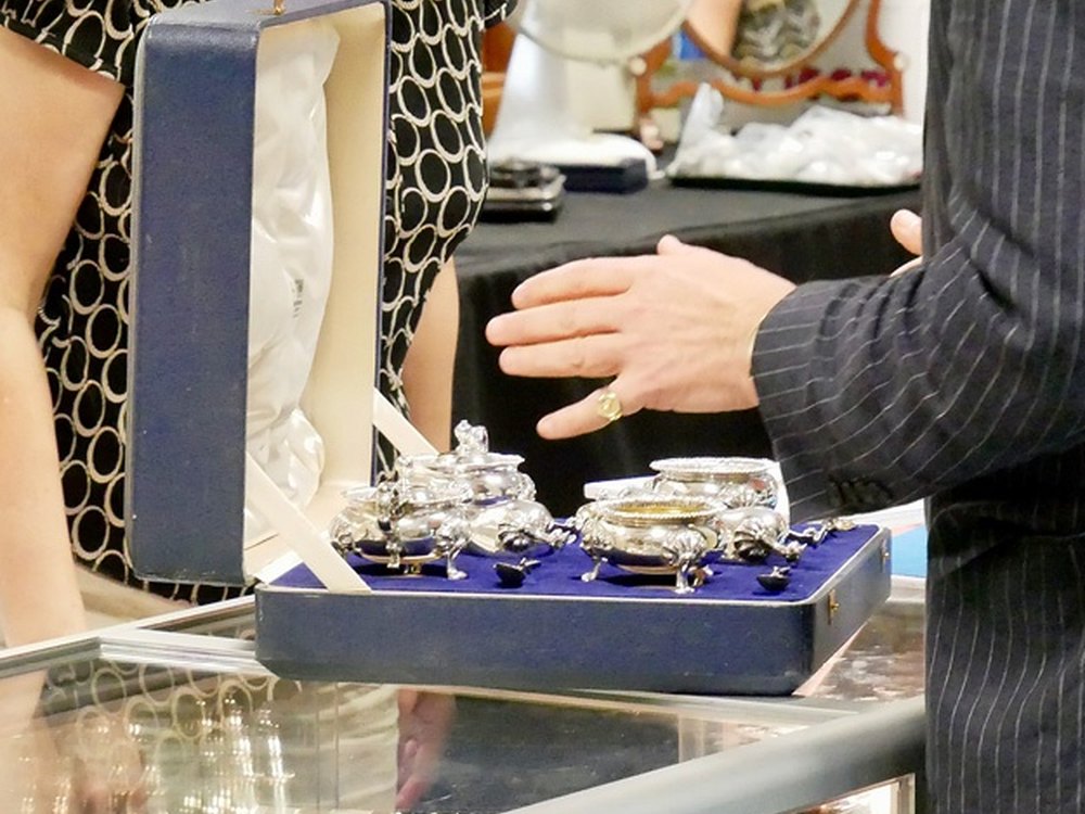 Viewing silver in the Halls saleroom